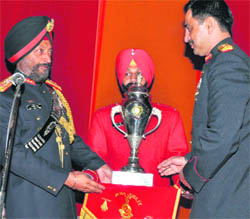 Chief of Staff, Western Command, Lt-Gen Baljeet Singh (left), presents a silver trophy to the commanding officer of 6 Sikh on the occasion of the units golden jubilee in Chandi Mandir on Thursday. 