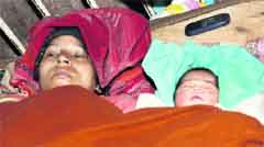 Sunita Devi and the newborn girl child in the Civil Hospital, Jalandhar
