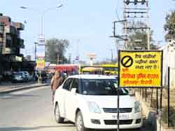 A vehicle parked beside a no-parking signboard at Jagraon