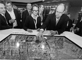 Prince Albert II of Monaco (R) uses a graphic table during a visit to the Imagina digital imaging exhibition in Monaco on February 8. Imagina is the international 3D market for professionals.