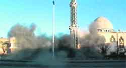 A video grab of smoke in front of a mosque after a blast in the Baba Amro neighbourhood in Homs.