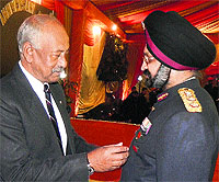 Lt-Gen SR Gosh being presented a commendation card on Friday