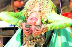 An artiste from Uzbekistan performs during the Surajkund Crafts Mela in Faridabad on Friday.