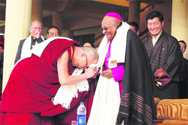 The Dalai Lama greets Archbishop Desmond Tutu, Nobel Peace Laureate, at McLeodganj in Dharamsala on Friday