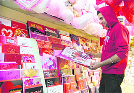 A youth takes a look at greeting cards ahead of Valentines Day at a shop in Ludhiana.