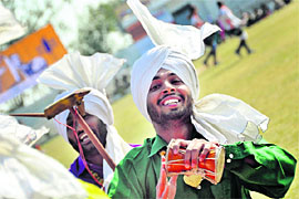 Youths perform Malvai giddha at the Kila Raipur Rural Sports Festival near Ludhiana on Friday. 