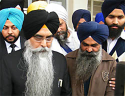 Rajinder Singh Sidhu (right) along with his counsel Nav Kiran Singh (left) coming out of the court after appearing in a case relating to Dera Sacha Sauda chief in Bathinda on Saturday.