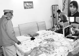 Forensics experts at a house in Sector 11, Panchkula, where a theft took place, on Saturday. 