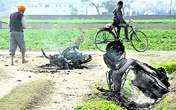 Two-wheelers burnt during a clash at Partabpura village in Jalandhar on Saturday