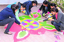 DMCH girls make a rangoli during Ectopia 2012 in Ludhiana on Saturday
