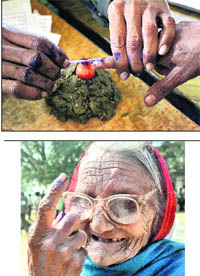 A woman gets her finger marked before casting her vote in Mau; and (right) an elderly voter shows her marked finger in Gorakhpur on Saturday.  PTI 