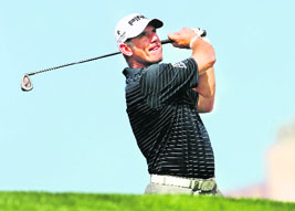 Lee Westwood of Britain plays a shot at the Dubai Desert Classic on Saturday. 