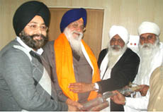Mahant Baba Kahan Singh and Baba Jagjit Singh honouring SGPC president Avtar Singh Makkar and (left) Jagmohan Singh Makkar at Goniana on Sunday. 