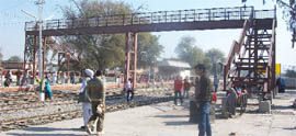 The incomplete railway foot ove bridge under which the passengers have been crossing the rail track putting their lives at risk. 
