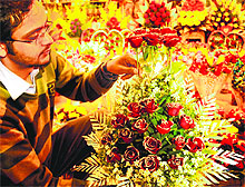 A florist prepares a bouquet of roses ahead of Valentine’s Day, in Chandigarh on Sunday
