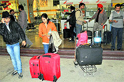Harassed passengers leave the airport after the Kingfisher flight was cancelled in Chandigarh on Sunday