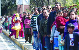 Visitors queue up to see the Mughal Gardens at the Rashtrapati Bhavan in New Delhi on Sunday.