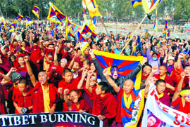 Tibetan monks hold a demonstration at the Parade Ground in Dehradun on Saturday