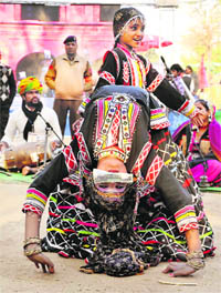 Rajasthan artistes perform at the Surajkund mela in Faridabad on Sunday.