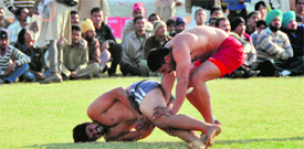 a kabaddi match in progress at the Kila Raipur Rural Sports Festival near Ludhiana on Sunday.