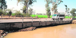 A vehicle crosses a bridge near Mehrajwala village in Muktsar district.  