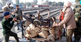 The hand truck that was hit by a goods train near the parcel office at Bathinda railway station on Thursday last.