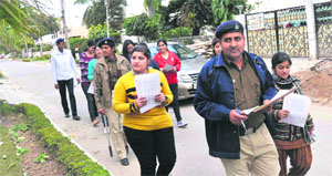Volunteers and police officials take part in awareness drive in Sector 36, Chandigarh, on Monday