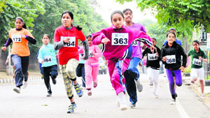 Girls participate in the Second Millennium Mini-Marathon organised by The Millennium School, Mohali