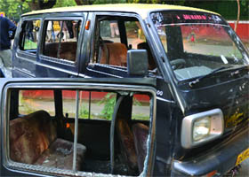 A taxi that was damaged during the bomb blast at Aurangzeb Road in New Delhi on Monday.