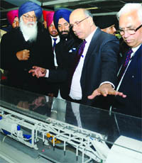 Prakash Singh Badal,Chief Minister of Punjab, with Mangu Singh, chairman of DMRC, and Manjinder Singh Sira travel on the Delhi Metro on Monday.