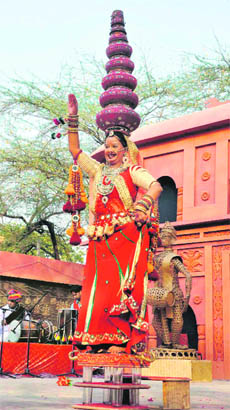 An artiste from Rajasthan performs during Surajkund Craft Mela in Faridabad. 