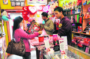 A woman selects Valentine's Day cards at a gift shop in Karnal. 
