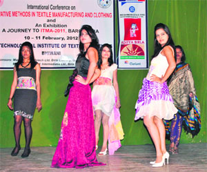 Models walk the ramp during a conference on Innovative methods in textile manufacturing and clothing in Bhiwani.
