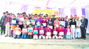 Meritorious students pose for a photograph at a samman samaroh in Pataudi. 