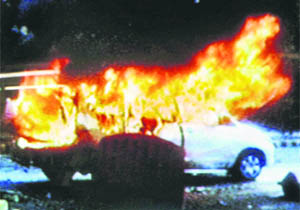 An Israeli embassy car in flames after an explosion in it near the mission in New Delhi on Monday. 
