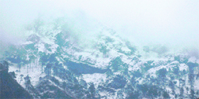 The snow-capped peaks of the Trikuta hills near Shri Mata Vaishno Devi Shrine in Katra on Monday.