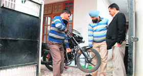 State Vigilance Commission officials attach the property of the Tehsil Supply Officer at Subhash Nagar in Jammu on Monday.