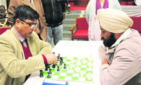 Jeetender Joshi (left) makes his move against Balbir Singh during the 5th All-India Defence Account Department Chess Championship in Chandigarh on Tuesday.