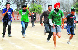 Students take part in the 100m dash during the athletics meet at the Dayanand Medical College and Hospital in Ludhiana on Tuesday.
