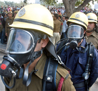 Commuters cover heads at a Metro station as part of the exercise.