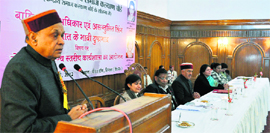 Chief Minister PK Dhumal addresses a gathering at a workshop on the rights of the girl child in Shimla on Wednesday.