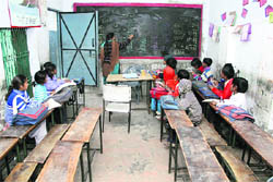 Thin attendance in a classroom at Government Middle School in Avtar Nagar.