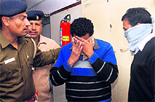 Receptionist Paramjit and bell boy Amit being taken for a medical examination in Chandigarh on Thursday