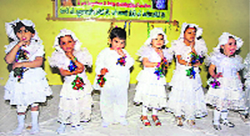 Children present an item at the annual function of Explorers Learning School in Fatehabad.