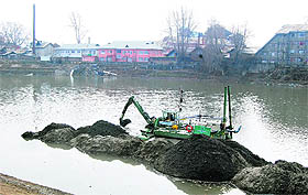 A dredger at work in the Jhelum in Srinagar. The state government is considering river transport system for the Kashmir valley this year. 