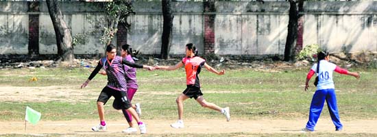 Girls take part in a 400 m relay race at the concluding day of the annual athletics meet of the Government College for Women in Ludhiana on Thursday