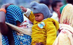 All protected from cold winds blowing in New Delhi on Friday.