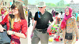 Foreign tourists at Malviya Ghat in Haridwar on Friday.