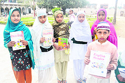 Students with English books on the way to a madrasa in Haridwar on Friday. Tribune photo: Rameshwar Gaur
