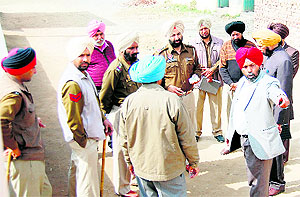 A teacher shows the spot where the shootout took place to a Majitha police team